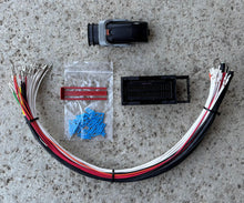 Load image into Gallery viewer, Cummins CM2350 and CM2450 connector photo showing kit components including wire, connector lock, and cavity plugs